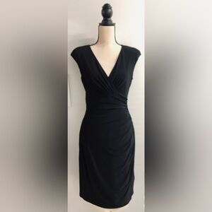 Like New Slim-Fitting Sleeveless Black Dress.